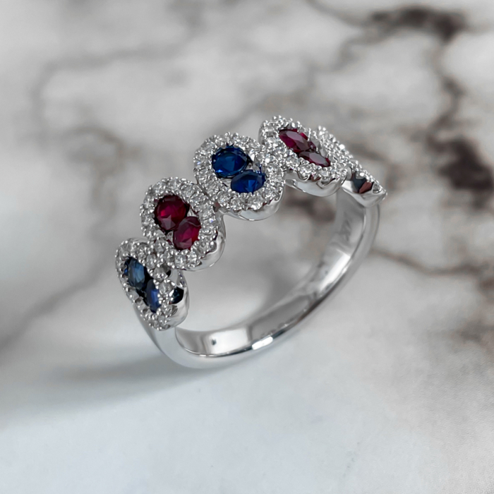 Sapphire and ruby station ring with diamond halos